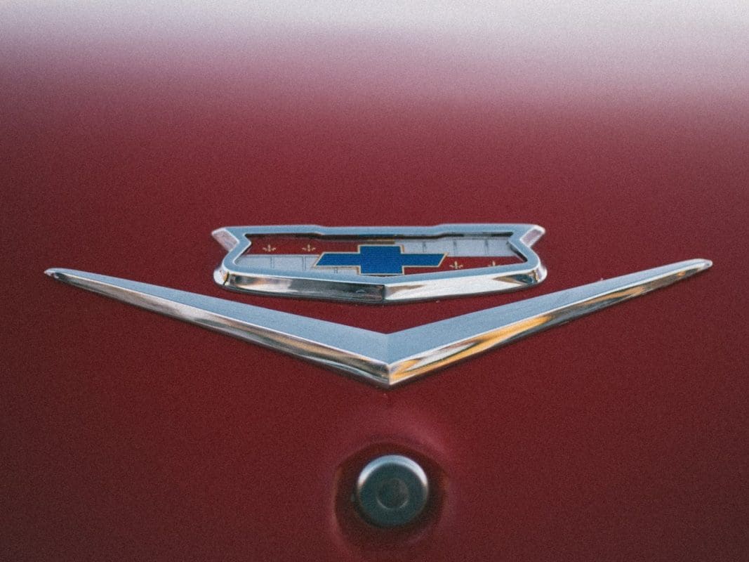 Chevrolet vehicle badge on red background
